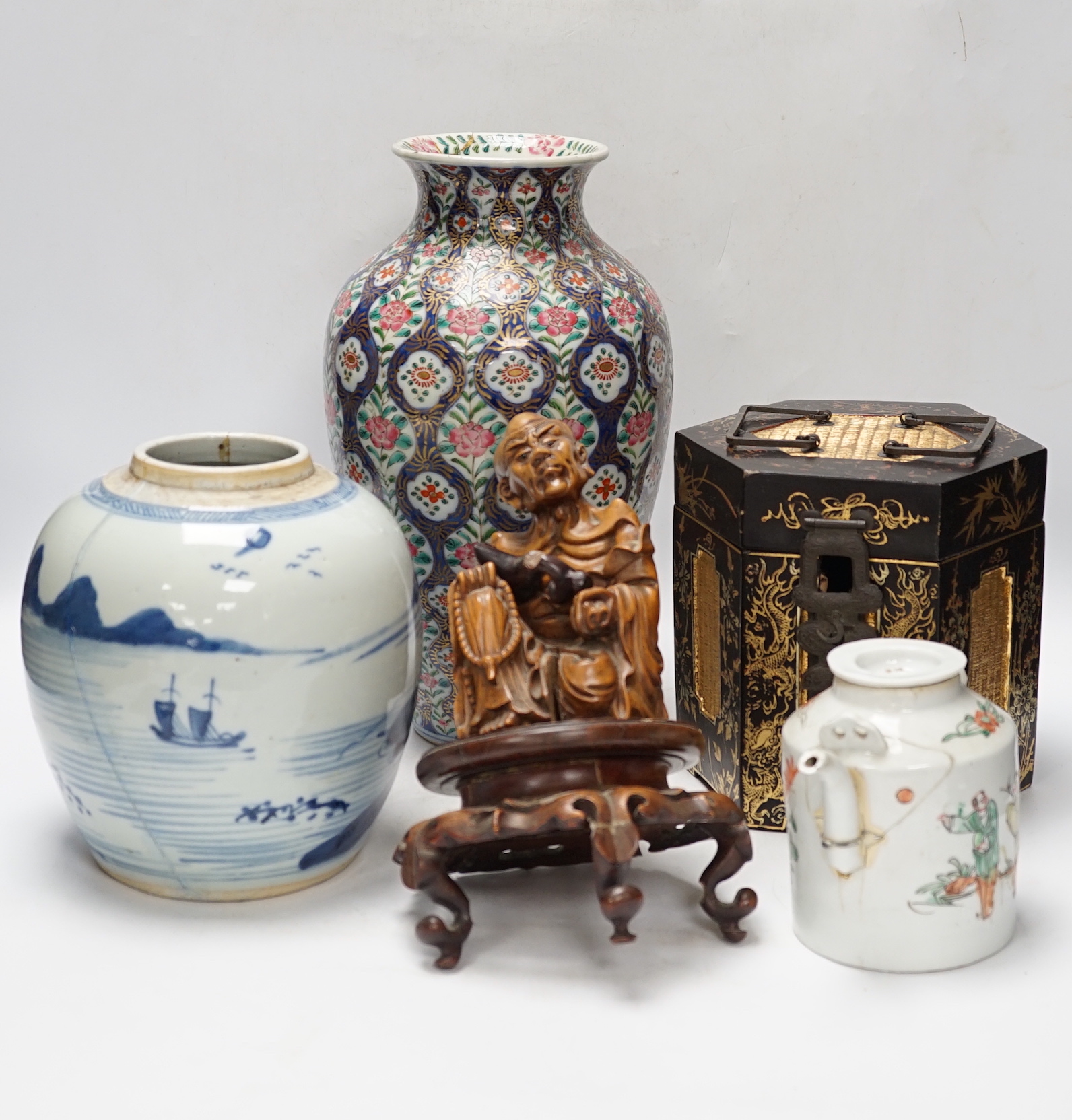 A group of Chinese items including a hardwood carving of luohan, an 18th century blue and white jar, a lacquer box, etc.